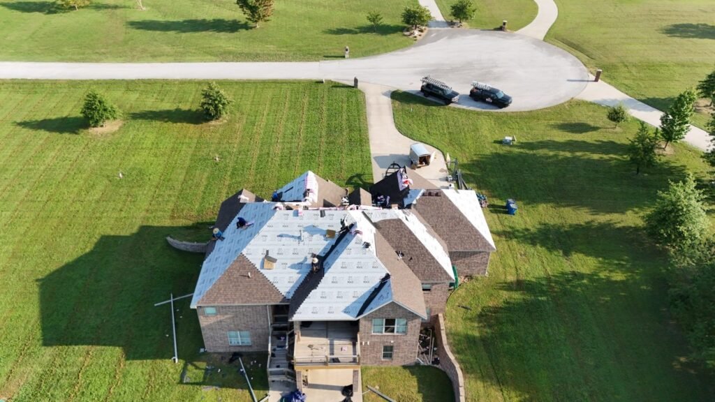 Bold Roofing crew and trucks during a roof replacement in Kinkade Village, Ozark, MO